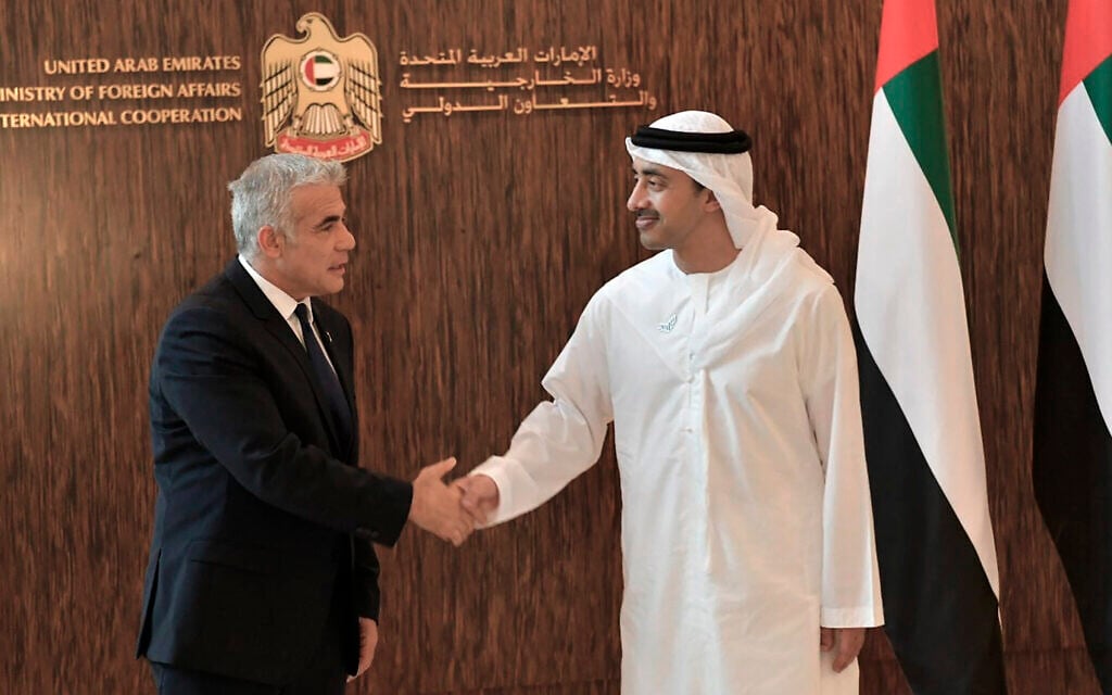 Foreign Minister Yair Lapid shakes hands with United Arab Emirates Foreign Minister Sheikh Abdullah bin Zayed al-Nahyan in Abu Dhabi, United Arab Emirates, June 29, 2021. (Shlomi Amsalem/Government Press Office via AP) Foreign Minister Yair Lapid shakes hands with United Arab Emirates Foreign Minister Sheikh Abdullah bin Zayed al-Nahyan in Abu Dhabi, United Arab Emirates, June 29, 2021. (Shlomi Amsalem/Government Press Office via AP)
