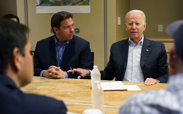 US President Joe Biden attends a briefing in Miami Beach, Florida with Florida Gov. Ron DeSantis, on the collapsed condo tower in Surfside, on July 1, 2021. (AP Photo/Susan Walsh) US President Joe Biden attends a briefing in Miami Beach, Florida with Florida Gov. Ron DeSantis, on the collapsed condo tower in Surfside, on July 1, 2021. (AP Photo/Susan Walsh)