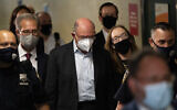 Allen Weisselberg, center, departs Manhattan criminal court, July 1, 2021, in New York. (AP Photo/John Minchillo)