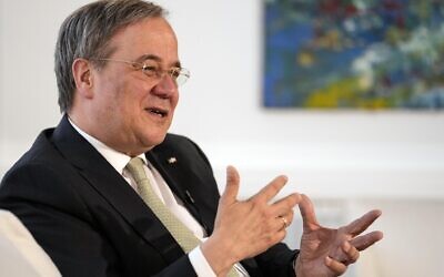 Governor of North Rhine-Westphalia Armin Laschet gestures during an interview with the Associated Press at his office in Duesseldorf, Germany, June 30, 2021. (AP Photo/Martin Meissner)