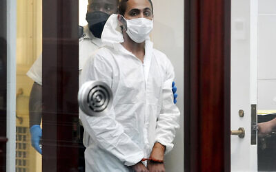 Khaled Awad is led into court while arraigned on charges in the stabbing of a rabbi near a Jewish day school, in Brighton District Court in Boston, Friday July 2, 2021. (Mary Schwalm/The Boston Herald via AP, Pool)
