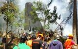 In this photo released by the Joint Task Force - Sulu, rescuers search for bodies from the site where a Philippine military C-130 plane crashed in Patikul town, Jolo province, southern Philippines on July 4, 2021. (Joint Task Force-Sulu via AP)