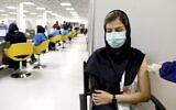 A medical worker gives the Sinopharm coronavirus vaccine at the Iran Mall shopping center in Tehran, Iran, May 17, 2021. (AP Photo/Ebrahim Noroozi, File)