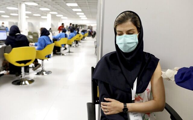 A medical worker gives the Sinopharm coronavirus vaccine at the Iran Mall shopping center in Tehran, Iran, May 17, 2021. (AP Photo/Ebrahim Noroozi, File) A medical worker gives the Sinopharm coronavirus vaccine at the Iran Mall shopping center in Tehran, Iran, May 17, 2021. (AP Photo/Ebrahim Noroozi, File)