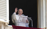 Pope Francis waves to the crowd as he arrives to recite the Angelus noon prayer from the window of his studio overlooking St. Peter's Square, at the Vatican on July 4, 2021. (AP Photo/Alessandra Tarantino)