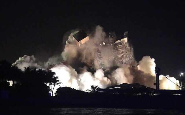 The remaining structure of the Champlain Towers South condo building is demolished more than a week after it partially collapsed, late Sunday, July 4, 2021, in Surfside, Fla. (AP Photo/Lynne Sladky) The remaining structure of the Champlain Towers South condo building is demolished more than a week after it partially collapsed, late Sunday, July 4, 2021, in Surfside, Fla. (AP Photo/Lynne Sladky)