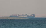 The Ever Given, a Panama-flagged cargo ship, is seen in Egypt's Great Bitter Lake, March 30, 2021. (AP Photo/Mohamed Elshahed, File),