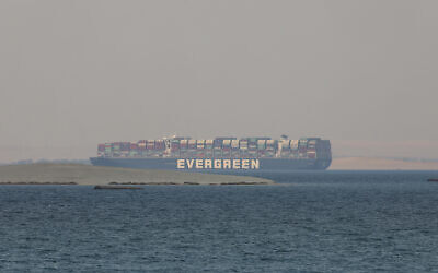 The Ever Given, a Panama-flagged cargo ship, is seen in Egypt's Great Bitter Lake, March 30, 2021. (AP Photo/Mohamed Elshahed, File),
