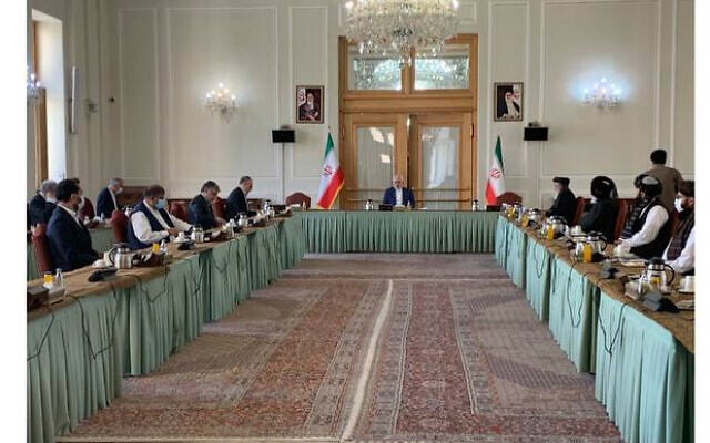 This photo released by the Iranian Foreign Ministry, shows a meeting between two delegations from the Taliban and the government of Afghanistan hosted by Iranian Foreign Minister Mohammad Javad Zarif, in Tehran, Iran, Wednesday, July 7, 2021. (Iranian Foreign Ministry via AP)