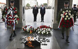 In this Thursday, June 21, 2018 file photo, Britain's Foreign Secretary Boris Johnson lays a wreath at the Tomb of the Unknown Soldier with his Polish counterpart Jacek Czaputowicz in Warsaw, Poland. Poland is reviving plans to reconstruct a historic Warsaw palace where the German Enigma machine codes were first cracked in 1932 and which Nazi German occupying forces blew up in 1944, it was announced Wednesday, July 7, 2021. (AP Photo/Czarek Sokolowski, file)