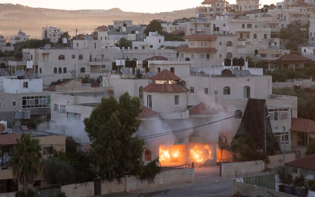 An Israeli army unit demolishes the house of Palestinian American Muntasser Shalaby using controlled explosions in the West Bank village of Turmus Ayya, north of Ramallah, Thursday, July 8, 2021. Shalaby is accused of being involved in a deadly attack on Israelis in the West Bank in May. (AP Photo/Nasser Nasser) An Israeli army unit demolishes the house of Palestinian American Muntasser Shalaby using controlled explosions in the West Bank village of Turmus Ayya, north of Ramallah, Thursday, July 8, 2021. Shalaby is accused of being involved in a deadly attack on Israelis in the West Bank in May. (AP Photo/Nasser Nasser)