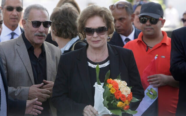 In this Oct. 6, 2015, photo, Jehan Sadat, widow of assassinated Egyptian president Anwar Sadat, lays a wreath at his tomb inside the memorial of the Unknown Soldier in Cairo, Egypt, marking the 42th anniversary of the Oct. 6 Arab-Israeli war in 1973. (AP Photo/Amr Nabil) In this Oct. 6, 2015, photo, Jehan Sadat, widow of assassinated Egyptian president Anwar Sadat, lays a wreath at his tomb inside the memorial of the Unknown Soldier in Cairo, Egypt, marking the 42th anniversary of the Oct. 6 Arab-Israeli war in 1973. (AP Photo/Amr Nabil)