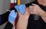 The Pfizer vaccine for COVID-19 is administered at the Arizona Department of Health Services State Laboratory in Phoenix, December 16, 2020. (Ross D. Franklin/AP)