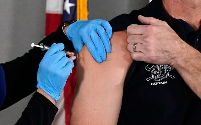 The Pfizer vaccine for COVID-19 is administered at the Arizona Department of Health Services State Laboratory in Phoenix, December 16, 2020. (Ross D. Franklin/AP) The Pfizer vaccine for COVID-19 is administered at the Arizona Department of Health Services State Laboratory in Phoenix, December 16, 2020. (Ross D. Franklin/AP)