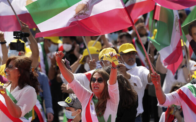 People attend a protest rally in Berlin, Germany, July 10, 2021 as part of the 'Free Iran World Summit 2021'. (AP Photo/Michael Sohn) People attend a protest rally in Berlin, Germany, July 10, 2021 as part of the 'Free Iran World Summit 2021'. (AP Photo/Michael Sohn)