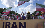 People attend a protest rally as part of the 'Free Iran World Summit 2021' in Berlin, Germany, July 10, 2021  (Michael Sohn/AP)