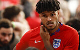 England's Tyrone Mings reacts following defeat to Italy at the Euro 2020 soccer championship final at Wembley stadium in London, Sunday, July 11, 2021. (John Sibley/Pool Photo via AP)