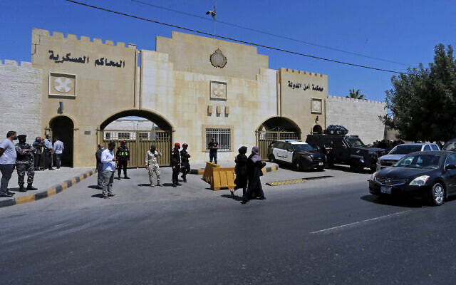 Security forces stand outside the state security court where the trial of Bassem Awadallah, a former royal adviser, and Sharif Hassan bin Zaid, a distant cousin of the king, takes place, in Amman, Jordan, June 21, 2021. (AP Photo/Raad Adayleh, File) Security forces stand outside the state security court where the trial of Bassem Awadallah, a former royal adviser, and Sharif Hassan bin Zaid, a distant cousin of the king, takes place, in Amman, Jordan, June 21, 2021. (AP Photo/Raad Adayleh, File)