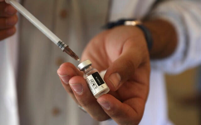 A doctor fills a syringe with the Johnson & Johnson COVID-19 vaccine at a vaccination center in Kabul, Afghanistan, July 11, 2021. (AP Photo/Rahmat Gul, file) A doctor fills a syringe with the Johnson & Johnson COVID-19 vaccine at a vaccination center in Kabul, Afghanistan, July 11, 2021. (AP Photo/Rahmat Gul, file)