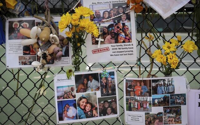 A memorial for the Guara family is posted on a fence near the Champlain Towers South, in Surfside, Florida, July 6, 2021. (Carl Juste/Miami Herald via A) A memorial for the Guara family is posted on a fence near the Champlain Towers South, in Surfside, Florida, July 6, 2021. (Carl Juste/Miami Herald via A)