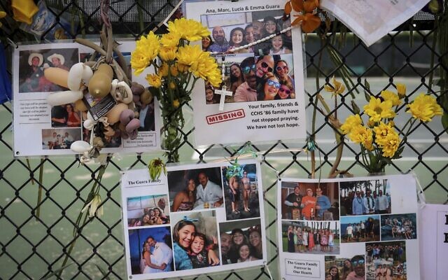 In this July 6, 2021, file photo, a memorial for the Guara family is posted on a fence near the Champlain Towers South, in Surfside, Florida (Carl Juste/Miami Herald via AP, File) In this July 6, 2021, file photo, a memorial for the Guara family is posted on a fence near the Champlain Towers South, in Surfside, Florida (Carl Juste/Miami Herald via AP, File)
