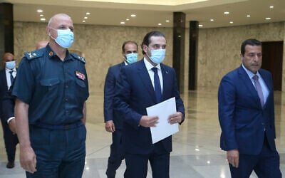 Lebanese Prime Minister-Designate Saad Hariri, center, arrives to his meeting with Lebanese President Michel Aoun at the presidential palace, in Baabda, east of Beirut, Lebanon, on July 14, 2021. (Dalati Nohra/Lebanese Official Government via AP)