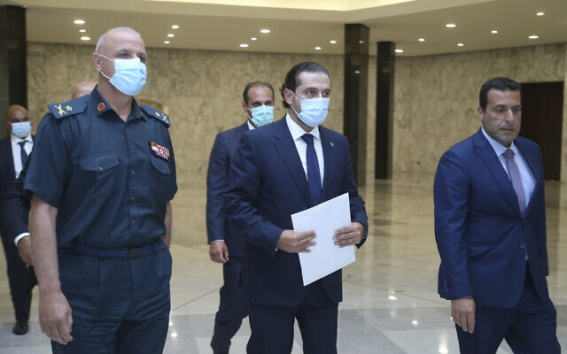 Lebanese Prime Minister-Designate Saad Hariri, center, arrives to his meeting with Lebanese President Michel Aoun at the presidential palace, in Baabda, east of Beirut, Lebanon, on July 14, 2021. (Dalati Nohra/Lebanese Official Government via AP) Lebanese Prime Minister-Designate Saad Hariri, center, arrives to his meeting with Lebanese President Michel Aoun at the presidential palace, in Baabda, east of Beirut, Lebanon, on July 14, 2021. (Dalati Nohra/Lebanese Official Government via AP)
