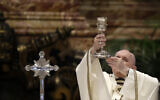 In this April 1, 2021 file photo, Pope Francis celebrates a Mass inside St. Peter's Basilica, at the Vatican. During the Mass the Pontiff blesses a token amount of oil that will be used to administer the sacraments for the year. Pope Francis cracked down on the spread of the old Latin Mass on Friday, July 16, 2021, reversing one of Pope Benedict XVI's signature decisions in a major challenge to traditionalist Catholics. (AP Photo/Andrew Medichini)