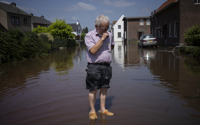 Wiel de Bie, 75, stands outside his flooded home in the town of Brommelen, Netherlands, on July 17, 2021. (AP Photo/Bram Janssen) Wiel de Bie, 75, stands outside his flooded home in the town of Brommelen, Netherlands, on July 17, 2021. (AP Photo/Bram Janssen)