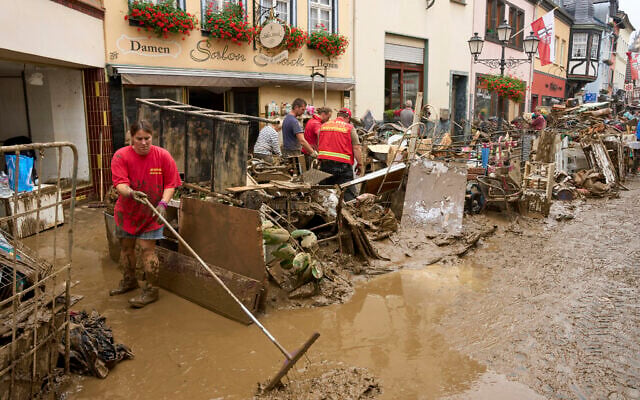 Residents and shopkeepers are trying to clear mud from their homes and move unusable furniture outside in Ahrweiler, western Germany, Saturday, July 17, 2021. Heavy rains caused mudslides and flooding in the western part of Germany. Multiple have died and are missing as severe flooding in Germany and Belgium turned streams and streets into raging, debris-filled torrents that swept away cars and toppled houses. (Thomas Frey/dpa via AP) Residents and shopkeepers are trying to clear mud from their homes and move unusable furniture outside in Ahrweiler, western Germany, Saturday, July 17, 2021. Heavy rains caused mudslides and flooding in the western part of Germany. Multiple have died and are missing as severe flooding in Germany and Belgium turned streams and streets into raging, debris-filled torrents that swept away cars and toppled houses. (Thomas Frey/dpa via AP)