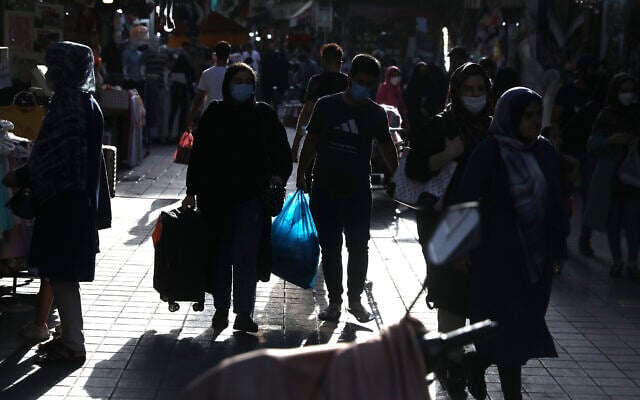People walk around in a commercial district in downtown Tehran, Iran, July, 17, 2021. (AP Photo/Vahid Salemi) People walk around in a commercial district in downtown Tehran, Iran, July, 17, 2021. (AP Photo/Vahid Salemi)