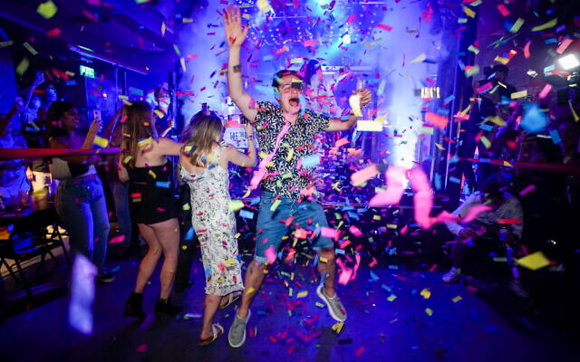 A man jumps on the dance floor shortly after the reopening, at The Piano Works in Farringdon, in London, Monday, July 19, 2021. The country's nightclubs are reopening for the first time in 17 months as almost all coronavirus rules are set to be scrapped. (AP Photo/Alberto Pezzali) A man jumps on the dance floor shortly after the reopening, at The Piano Works in Farringdon, in London, Monday, July 19, 2021. The country's nightclubs are reopening for the first time in 17 months as almost all coronavirus rules are set to be scrapped. (AP Photo/Alberto Pezzali)