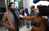 Journalist and activist Omar Radi speaks after a hearing at the Casablanca Courthouse, in Casablanca, Morocco, March 5, 2020. (AP Photo/Abdeljalil Bounhar, File)