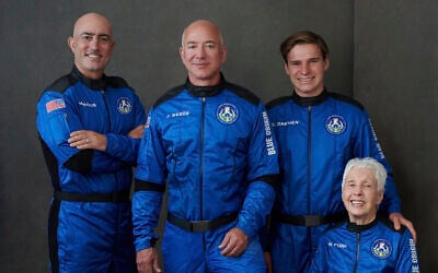 In this photo provided by Blue Origin, from left to right: Mark Bezos, brother of Jeff Bezos;
Jeff Bezos, founder of Amazon and space tourism company Blue Origin; Oliver Daemen, of the Netherlands;
and Wally Funk, aviation pioneer from Texas, pose for a photo. (Blue Origin via AP)