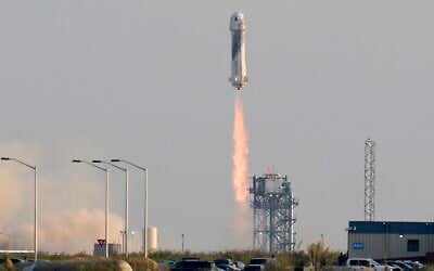 Blue Origin's New Shepard rocket launches carrying passengers Jeff Bezos, founder of Amazon and space tourism company Blue Origin, brother Mark Bezos, Oliver Daemen and Wally Funk, from its spaceport near Van Horn, Texas, July 20, 2021. (AP Photo/Tony Gutierrez)