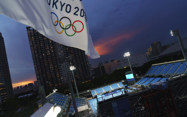 An Olympic flag flies above the Ariake Tennis Center at the 2020 Summer Olympics, on Tuesday, July 20, 2021, in Tokyo. (AP Photo/David Goldman) An Olympic flag flies above the Ariake Tennis Center at the 2020 Summer Olympics, on Tuesday, July 20, 2021, in Tokyo. (AP Photo/David Goldman)