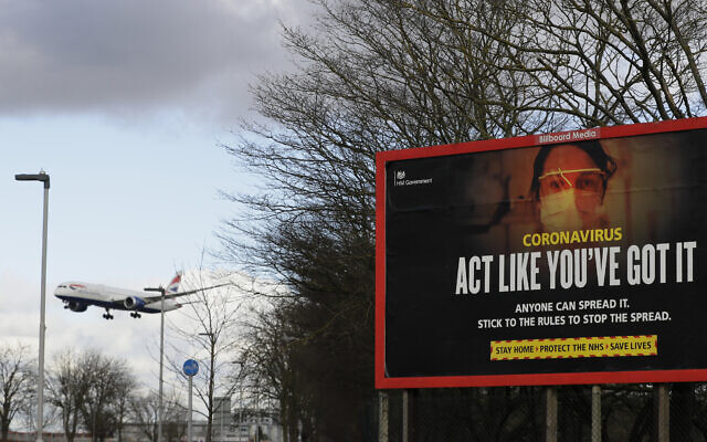 A plane comes in to land near a government coronavirus information sign at Heathrow Airport in London, February 5, 2021. (AP Photo/Kirsty Wigglesworth, FILE) A plane comes in to land near a government coronavirus information sign at Heathrow Airport in London, February 5, 2021. (AP Photo/Kirsty Wigglesworth, FILE)