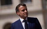 French President Emmanuel Macron attends a farewell ceremony for the French armed forces chief of staff, Gen. Francois Lecointre, at the Invalides monument in Paris, on July 21, 2021. (Daniel Cole/AP)