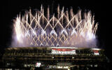 Fireworks illuminate over the National Stadium during the opening ceremony of the 2020 Summer Olympics, Friday, July 23, 2021, in Tokyo. (AP Photo/Shuji Kajiyama)