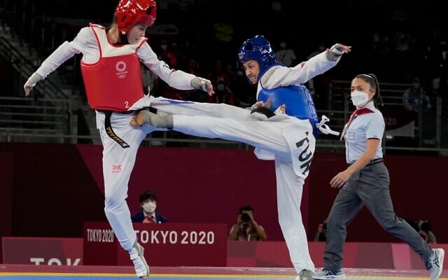 Israel's Avishag Semberg, left, competes with Turkey's Rukiye Yıldırım during the women's 49kg taekwondo match at the 2020 Summer Olympics, on Saturday, July 24, 2021, in Tokyo, Japan. (AP Photo/Themba Hadebe). Israel's Avishag Semberg, left, competes with Turkey's Rukiye Yıldırım during the women's 49kg taekwondo match at the 2020 Summer Olympics, on Saturday, July 24, 2021, in Tokyo, Japan. (AP Photo/Themba Hadebe).