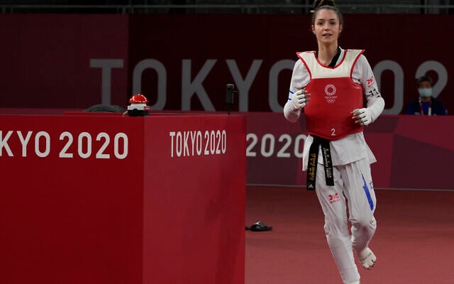 Israel's Avishag Semberg celebrates after defeating Turkey's Rukiye Yıldırım to win a bronze medal during the women's 49kg taekwondo match at the 2020 Summer Olympics, on Saturday, July 24, 2021, in Tokyo, Japan. (AP/Themba Hadebe).