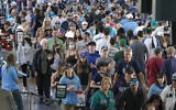 Fan file through the main concourse of T-Mobile Park before a baseball game between the Seattle Mariners and the Oakland Athletics, Saturday, July 24, 2021, in Seattle. (AP/Ted S. Warren)