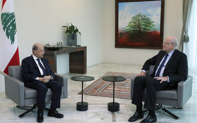 Lebanese President Michel Aoun, left, meets with former Lebanese Prime Minister Najib Mikati, at the presidential palace, in Baabda, east of Beirut, Lebanon, July 26, 2021. (Dalati Nohra/Lebanese Official Government via AP) Lebanese President Michel Aoun, left, meets with former Lebanese Prime Minister Najib Mikati, at the presidential palace, in Baabda, east of Beirut, Lebanon, July 26, 2021. (Dalati Nohra/Lebanese Official Government via AP)
