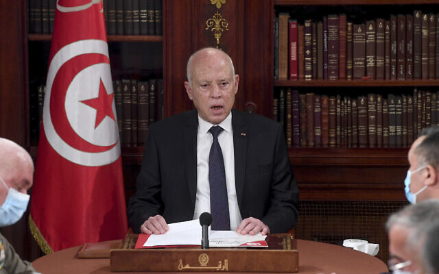 Tunisia's President Kais Saied, center, leads a security meeting with members of the army and police forces in Tunis, Tunisia, July 25, 2021. (AP Photo/Slim Abid)