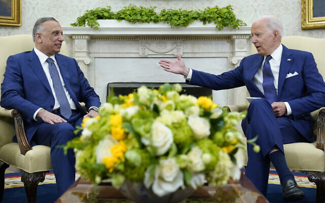 US President Joe Biden, right, speaks as Iraqi Prime Minister Mustafa al-Kadhimi, left, listens during their meeting in the Oval Office of the White House in Washington, July 26, 2021. (AP Photo/Susan Walsh) US President Joe Biden, right, speaks as Iraqi Prime Minister Mustafa al-Kadhimi, left, listens during their meeting in the Oval Office of the White House in Washington, July 26, 2021. (AP Photo/Susan Walsh)