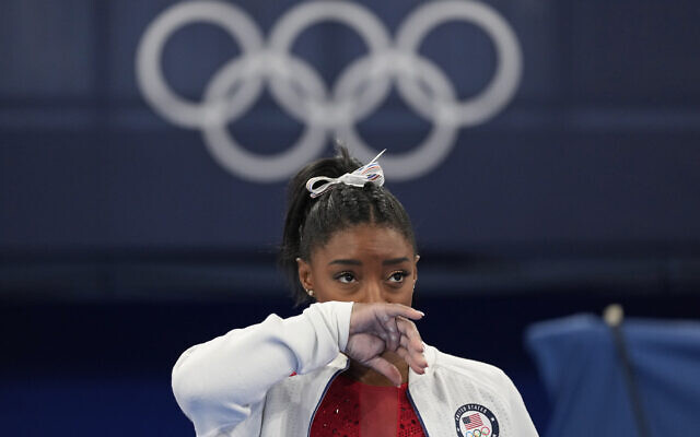 Simone Biles, of the United States, watches gymnasts perform at the 2020 Summer Olympics in Tokyo, July 27, 2021. (Ashley Landis/AP) Simone Biles, of the United States, watches gymnasts perform at the 2020 Summer Olympics in Tokyo, July 27, 2021. (Ashley Landis/AP)