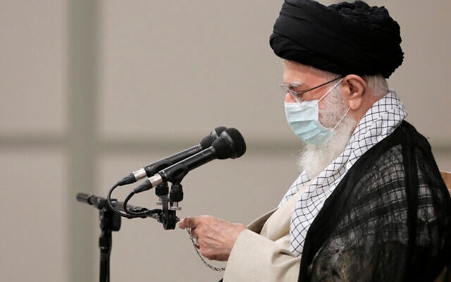 In this photo released by an official website of the office of the Iranian supreme leader, Supreme Leader Ayatollah Ali Khamenei checks the time in farewell meeting with outgoing President Hassan Rouhani's administration in Tehran, Iran, Wednesday, July 28, 2021. (Office of the Iranian Supreme Leader via AP) In this photo released by an official website of the office of the Iranian supreme leader, Supreme Leader Ayatollah Ali Khamenei checks the time in farewell meeting with outgoing President Hassan Rouhani's administration in Tehran, Iran, Wednesday, July 28, 2021. (Office of the Iranian Supreme Leader via AP)