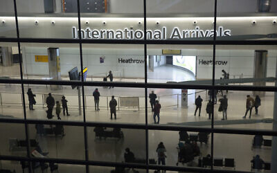 In this January 26, 2021 photo, people in the International Arrivals area at Heathrow Airport in London, during England's coronavirus lockdown. (AP/Matt Dunham)