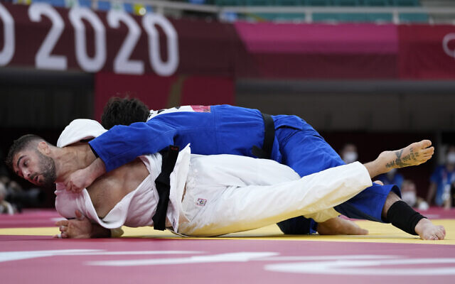 Peter Paltchik of Israel, left, and Aaron Wolf of Japan compete in the men's -100kg quarterfinal round judo match of the 2020 Summer Olympics in Tokyo, Japan, July 29, 2021. (AP/Vincent Thian) Peter Paltchik of Israel, left, and Aaron Wolf of Japan compete in the men's -100kg quarterfinal round judo match of the 2020 Summer Olympics in Tokyo, Japan, July 29, 2021. (AP/Vincent Thian)