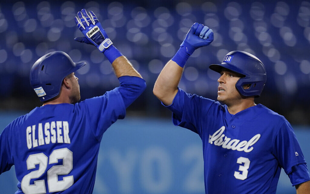 Israel's Ian Kinsler celebrates with Mitchell Glasser after hitting a home run in the third inning of a baseball game against South Korea at the 2020 Summer Olympics, on July 29, 2021, in Yokohama, Japan. (AP Photo/Sue Ogrocki) Israel's Ian Kinsler celebrates with Mitchell Glasser after hitting a home run in the third inning of a baseball game against South Korea at the 2020 Summer Olympics, on July 29, 2021, in Yokohama, Japan. (AP Photo/Sue Ogrocki)